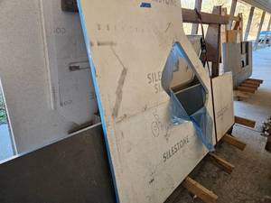 lot 122 image: Miscellaneous Lot of Larger Quartz Countertop Pieces  Includes New Cosentino Quartz