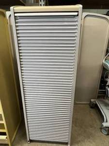 lot 30 image: Herman Miller Milcare Storage Supply Multiple Drawer Cabinet With Roll Up Accordion Door Closure - In Great Condition