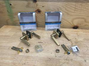 lot 147 image: DEFIANT Lot of 2- Tonebridge Brushed Gold BedBath Door Levers with Square Rose