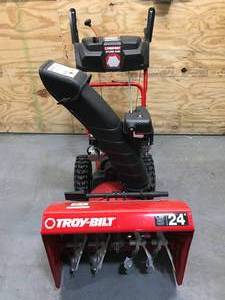lot 4 image: Troy-Bilt Storm 2420 Snow Blower Model # 31AS6KN2B23