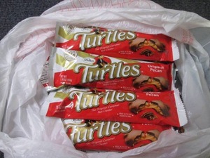 lot 57 image: 12- 1.76 oz Turtles...