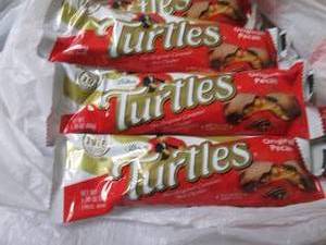 lot 100 image: 12- 1.76 oz Turtles...