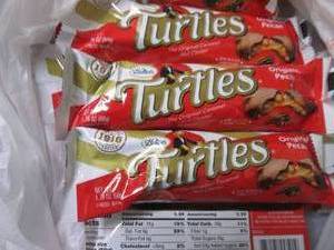 lot 104 image: 12- 1.76 oz Turtles...