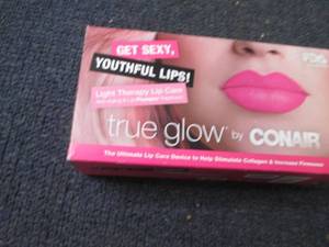 lot 345 image: Conair Light Therapy Lip Care...