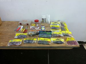 lot 519 image: Fishing Tackle Lot with Culprit Worms and Fishing Reel