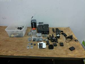 lot 691 image: Lot of GoPro Accessories Including Mounts, Cases, and Cables