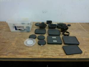 lot 704 image: Lot of Camera Lens Caps and Accessories - Canon & Sony