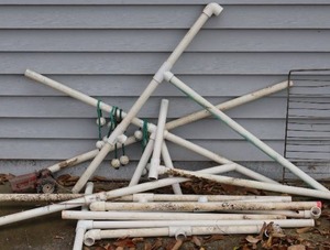 lot 253 image: Yard Game of Golf Ball Toss Ring and Metal Tractor