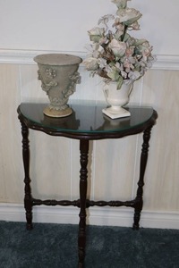 lot 64 image: Vintage Half-Moon Wood Console Occasional Flush-Wall Glass-Top Table, Custom Urn Floral Arrangement Etc...