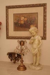 lot 28 image: Venetian Victorian Home Decor Wall Table Art, Child wRose Statue, Floral Rose Matted Print, Candelabra, Syroco Shelf