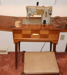 lot 145 image: Vintage Singer Pedal Sewing Machine in Beautiful Patchwork-Style Wood Cabinet wStorage Bench