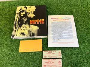 lot 38 image: Woodstock Tickets 1969 & Hippie Hardcover Book