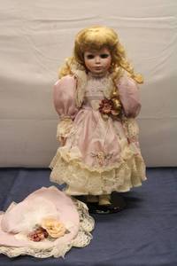 lot 22 image: Collectible Porcelain Doll with Attire and Hat - Limited Edition
