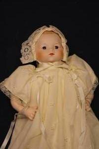 lot 25 image: Vintage Baby Doll in Yellow Dress with Bonnet