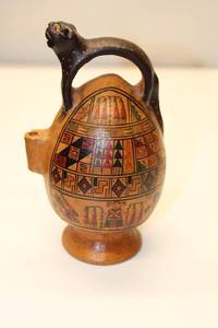 lot 37 image: Handcrafted Vintage Clay Pitcher with Animal Handle - Unique Design