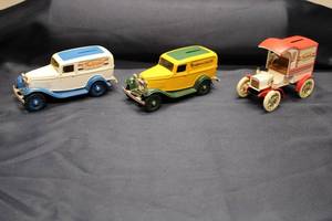 lot 108 image: Set of 3 Vintage Coin Banks - True Value & Montgomery Ward Design