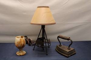 lot 127 image: Vintage Collection Marble Goblet, Cast Iron Vintage Iron, and Bear-themed Table Lamp