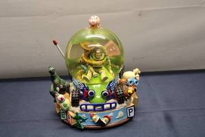 lot 137 image: Toy Story Musical Snow Globe with Characters - Buzz Lightyear & Friends