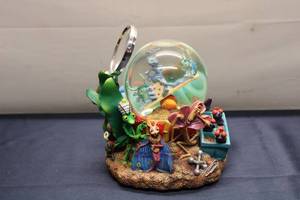 lot 139 image: Whimsical Snow Globe Featuring Colorful Caterpillar and Characters