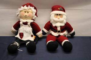 lot 179 image: Set of 2 Musical Mr. & Mrs. Claus Sitters - Decorative Plush Dolls