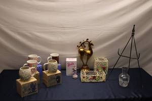 lot 181 image: Assortment of Vintage Collectibles Mugs, Barbie Figurine, Decorative Baskets, and Stand