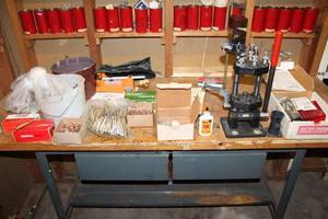 Assortment of Reloading Supplies - Primers, Brass Casings, and Press