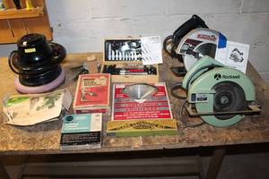 Assortment of Power Tools and Accessories Including Circular Saws and Drill Attachments
