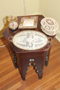 Vintage Hexagonal Table with Decorative Items Tray, Picture Frame, Birdcage, and Wicker Basket