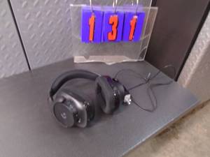 Logic tech cordless headphones. Power up. As shown.