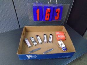 Flat of new lighters & knives. As shown.