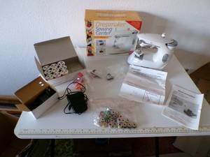 lot 49 image: (CSB) New Dressmaker Sewing Center Machine - New In Box