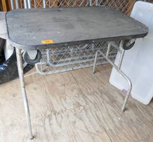 Interesting collapsible folding table with wheels 24x36 x 30 tall