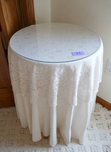 lot 11 image: Simple table with lace drape and glass top