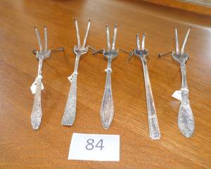 lot 84 image: FIVE vintage silverware napkin holders