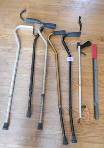 lot 93 image: Group of height adjustable canes, a reacher and a long shoe horn