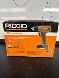 lot 23 image: RIDGID 18V Brushless Sub Compact Cordless 12 in. Drill Driver Kit with 2 2.0 Ah Battery, Charger and Bag