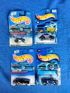 4 New Mattel Hot Wheels Cars First Edition, Camaro, Radio Flyer, and Others