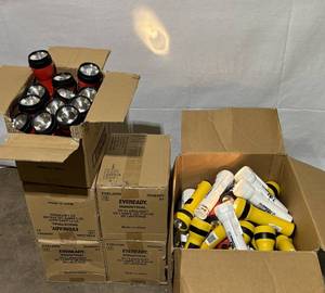 lot 128 image: MSRP $400  4 Cases (12 Flashlights per case) NEW Eveready Industrial 2D LED Flashlights - Includes lot of mixed workinguntested flashlights as shown on right. 