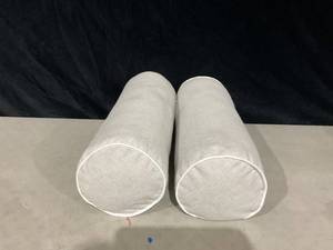lot 753 image: LOT OF 2 20x8 Cylinder Outdoor Bolster Pillows with Contrast Piping - Threshold designed with Studio McGee