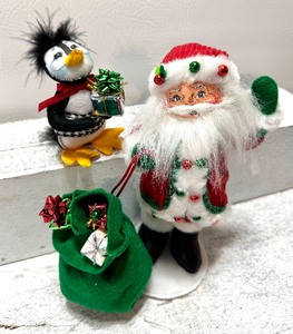 lot 254 image: ANNA LEE Santa and Penguin with Gifts