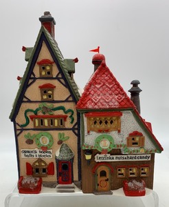 lot 479 image: DEPT 56 North Pole Series Obbies Books and Letrinkas Candy House