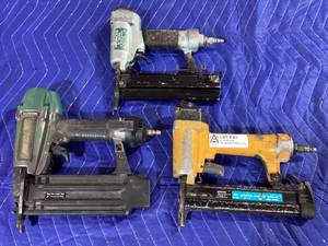 lot 043 image: Assorted Pneumatic Fastening Tools Hitachi NT50AD Brad Nailer, Bostitch SB-150SX Stapler, and Masterforce 208-5005 Brad Nailer