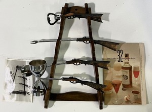 lot 35 image: Vintage GunRilfle Theme Barware  Drink Mixing Cocktail Set and Gun Rack  Display in Box
