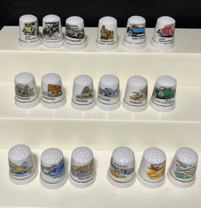 lot 102 image: LOT of Eighteen Thimbles - Dinosaur, Antique Cars, Fighter Planes