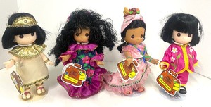 lot 113 image: Four Precious Moments Children of the World Dolls