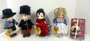 lot 128 image: Austria, Russia, Spain and Switzerland Children of the World Dolls by Precious Moments and Pocket Guide Book