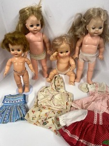 lot 117 image: Lot of 4 Vinyl 1960s Dolls Vogue, Kellogs and Horsman Baby Doll and Two Vogue Outfits