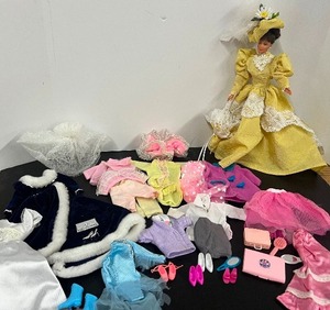 lot 1 image: Lot of 1980-1990s Barbie Clothing, Skating Outfit, Dreamtime Teddy Bear, Accessories and Barbie Doll