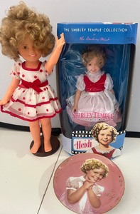 lot 96 image: Shirley Temple Doll 1972 by Ideal, Shirly Temple as Heidi by Danbury Mint and Collectors Plate