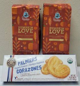 lot 53 image: (2) Caribou Coffee  Pumpkin Love - A Pumpkin (1) Natural Nectar Palmiers Corazones - Organic Cookies